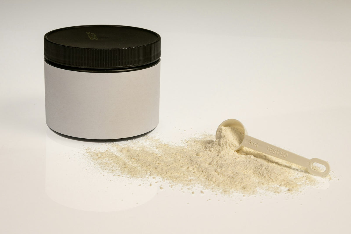 Whey protein powder jar with measuring scoop